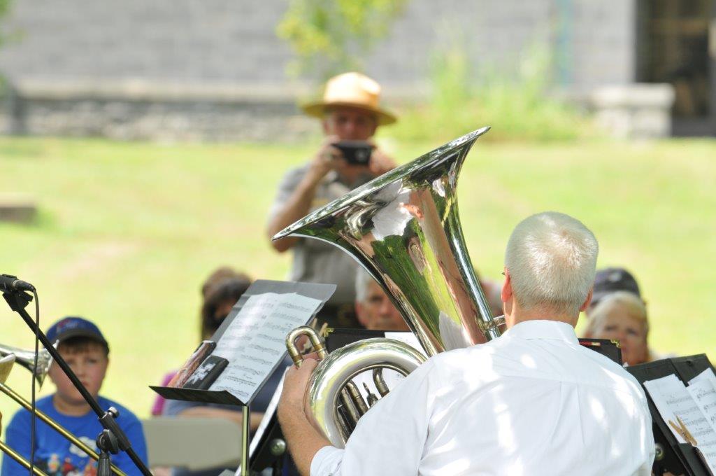 The TPO Brass Quintet Marcu Arnold plays while ranger Jim Lewis records the event.