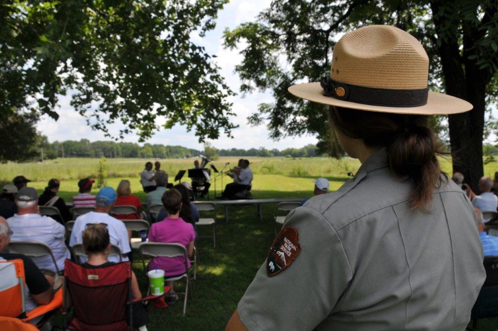 A park employee, Ava Joiner, takes in the music from the eartly days of our country.